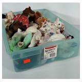 Storage tote (no lid) with plush toys. Many are