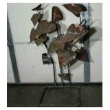 Metal sculpture, copper leaves, shows patina,