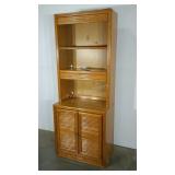 Two piece bookcase/storage cabinet. Double door