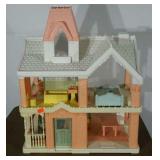 Plastic dollhouse, includes some furniture and