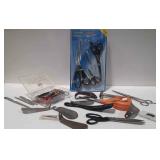 Group with scissors, shoe horns, razor, files