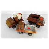 Three Tonka trucks, all show age wear
