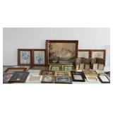 Group of picture frames, framed prints, and