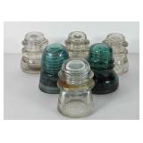 Six glass insulators, some have damage, see