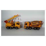 2 poly toy trucks by Bruder. Each is