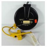 Retractable extension cord reel with circuit