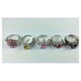 Five silvertone rings sizes 6,7,and 8