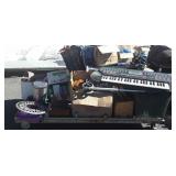 Group of suitcase, books, galvanized bucket,