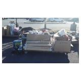 Group of stuffed teddy bears, wood slats, books