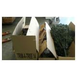 Skid with three artificial Christmas trees with