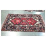 Woven rug with geometric native design. Damaged