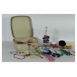 Older Suitcase style cosmetic case with costume