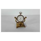 Pocket watch style brass clock, stands 4" tall,