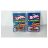 Hot Wheels die cast cars, both have red lines on