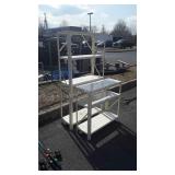 Two lightweight metal shelf units, 30 in wide x