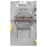 Wrought-iron chair, bottom is damaged