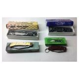 Four pocket knives with boxes