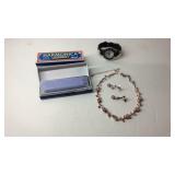 Two harmonicas, wrist watch, and a necklace and