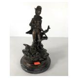 Bronze hunter reloading statue on marble base,