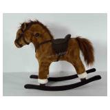 Toddler size rocking horse. Push ear and it sings