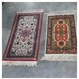 2 throw rugs with fringes. Red and blue measures