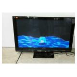 Panasonic 50" High Definition Plasma TV on stand.