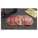 3 metal stop signs