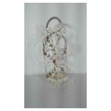 Metal wine rack with pink flower design. Holds 3