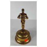 Brass tone Oscar styled statue, stands 12" tall