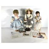 Three Hamilton Collection porcelain dolls,