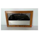 Wood framed mirror. Measures approximately 17x28