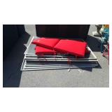 2 red seat cushions and 12 window screens, mixed
