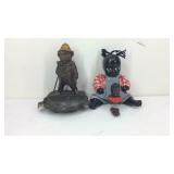 Two black Americana figurines and a monkey