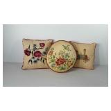 Three throw pillows, all need laundered