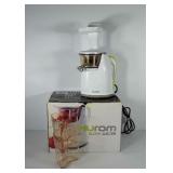 Hurom slow juicer in box, powers up