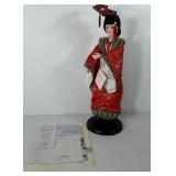 Porcelain doll with stand and certificate of