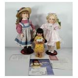 Three porcelain dolls with stands and paperwork,