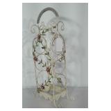 Metal wine rack with pink flower design. Holds 3
