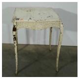 Occasional table with chippy paint and carved