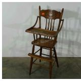 Highchair with carved detail, tray has fruit