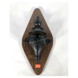 Architectural cast iron pieces on wall plaque,