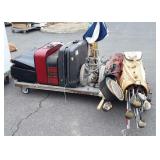 Skid of suitcases, metal trunk, brass umbrella