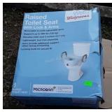Raised Toilet Seat appears new in box, seller