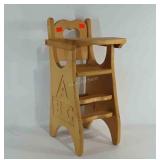 Doll sized wooden high chair with etched alphabet