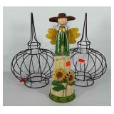 Yard art, includes metal figure with sunflowers