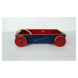 Wooden wagon with wooden wheels and rope pull.