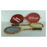 Two older tennis rackets. One Wilson, one