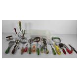 Small storage bin of kitchen utensils, includes