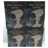 Four mock non functioning security cameras