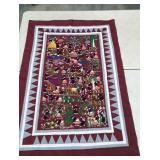 Storycloth tapestry with traditional scene,